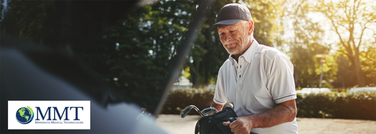 Elderly man getting golf clubs out of his car outside