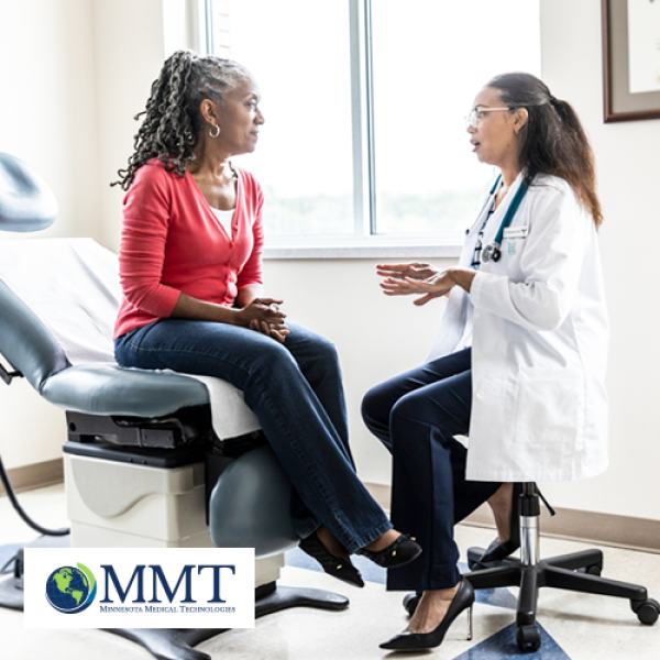 Female doctor and female patient speaking together in a doctor