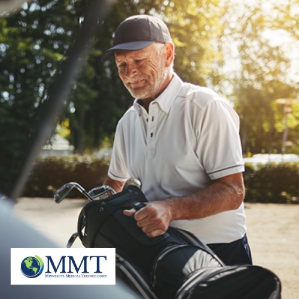 Elderly man getting golf clubs out of his car outside
