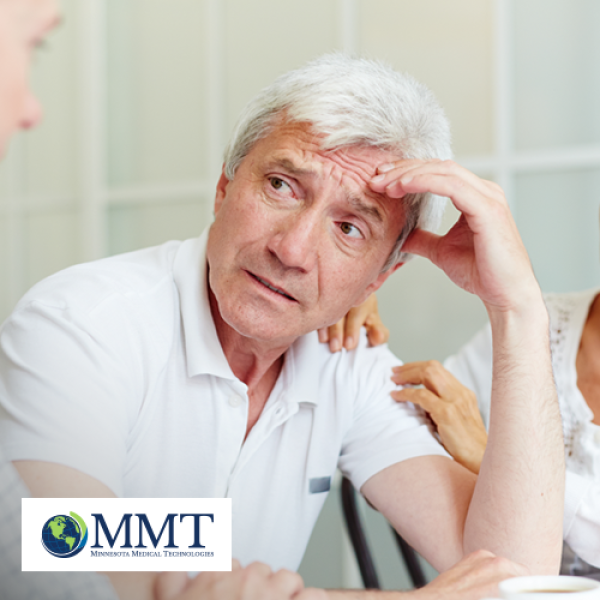 Man looking concerned at another person with his wife offering comfort in the background